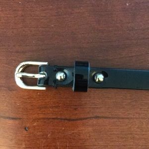 Skinny black patent leather belt